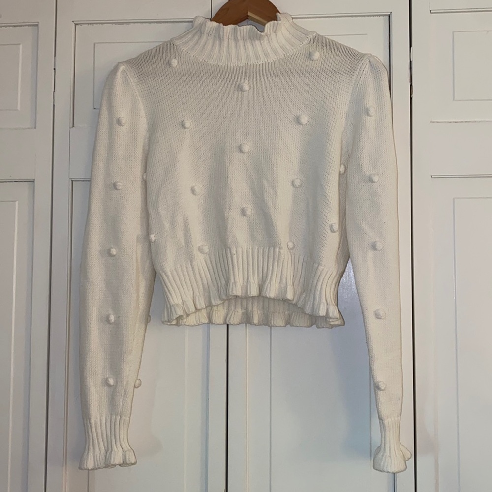 Storia mock neck sweater with Pom Pom detail